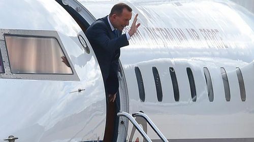 Mr Abbott preparing to leave Canberra on Friday afternoon. (AAP)