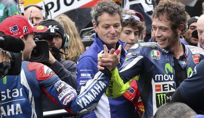 But Lorenzo was the first to congratulate Rossi. (AAP)
