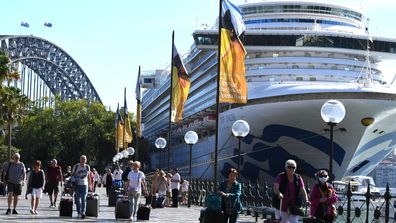Cruise ship passengers disembark from the Ruby Princess at Circular Quay in Sydney, on March 19.