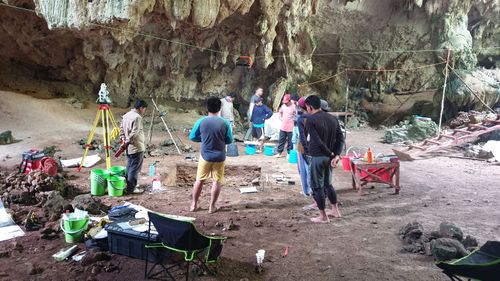 Australian and Indonesian archaeologists inside the Borneo cave.