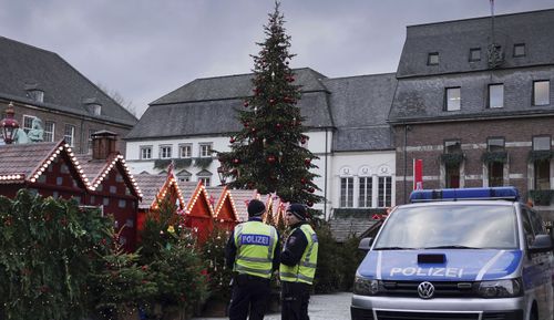 Police officers watch the Christmas Market in Duesseldorf, 