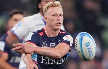 Carter Gordon of the Rebels passes the ball during the round 11 Super Rugby Pacific match between Melbourne Rebels and Blues.