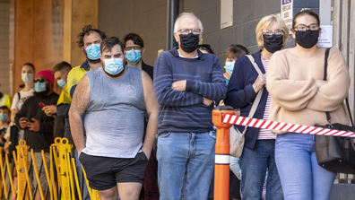 People are seen lining up to be tested for COVID-19 at a testing clinic at Ipswich Hospital on August 24, 2020 in Brisbane, Australia.