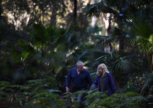 Mark and Faye Leveson, the parents of Matthew Leveson, return to bushland in the Royal National Park along with NSW Police south of Sydney, in 2017. (AAP)