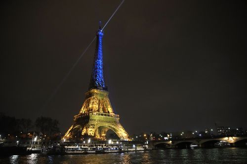 The Eiffel Tower is illuminated with the colors of Ukraine to mark the one-year anniversary of Russia's invasion of the country, in Paris, Thursday, Jan. 23, 2023.