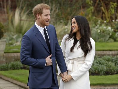 Prince Harry and fiancee Meghan Markle pose for photographers during a photocall announcing their engagement.