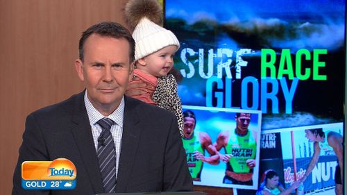 Sports presenter Tony Jones seemed less than impressed to have Millie-Belle steal the show during his broadcast.
