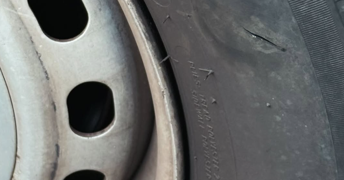 Woman arrested after tyres slashed on dozens of cars on southern Gold Coast