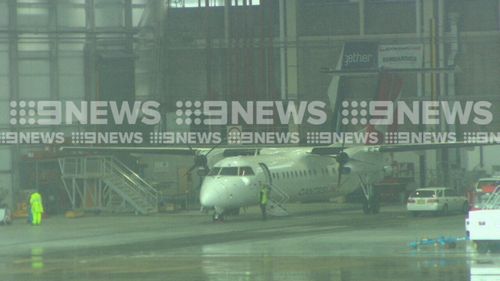 The damaged plane returned to Gate T3 and was towed to an engineering hanger to be inspected. Picture: 9NEWS