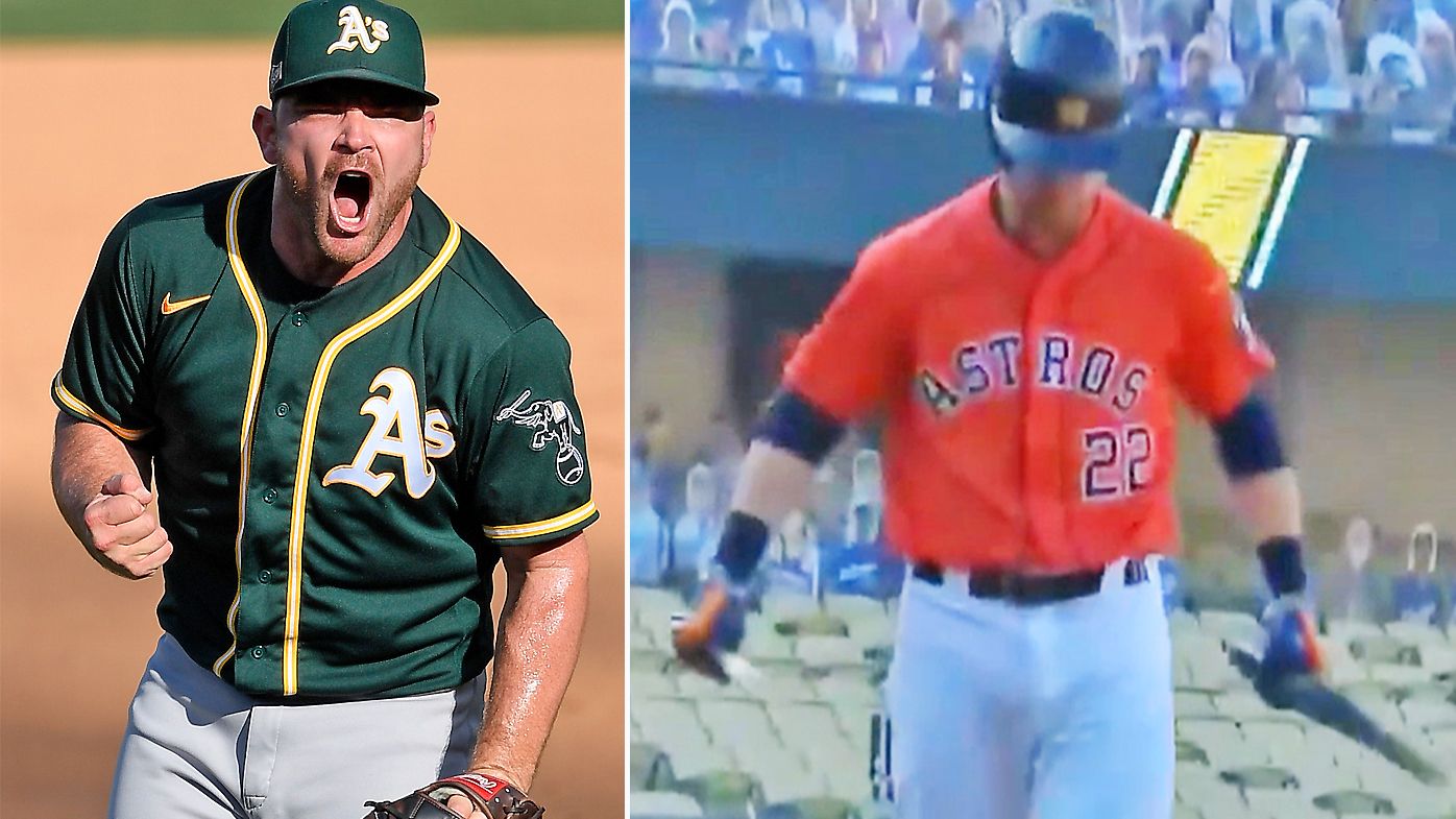 Houston Astros&#x27; Josh Reddick breaks his bat over his knee after striking out against the Oakland Athletics&#x27; Liam Hendriks
