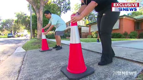 Frank's neighbours have set up witches hats in the hope of stopping people from blocking his driveway.