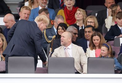 (L-R front row) Prime Minister Boris Johnson, Mike Tindall and Mia Grace Tindall wait ahead of the Platinum Pageant on June 05, 2022 in London, England.