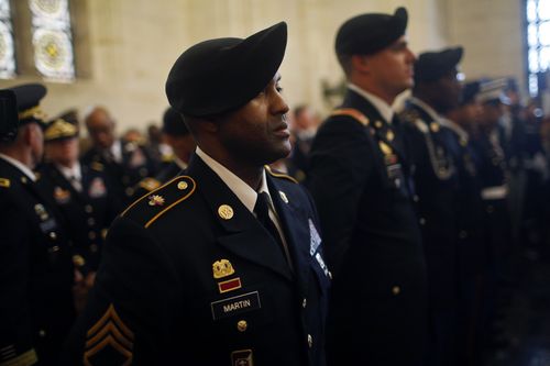 An American soldier stands during the remembrance ceremony.