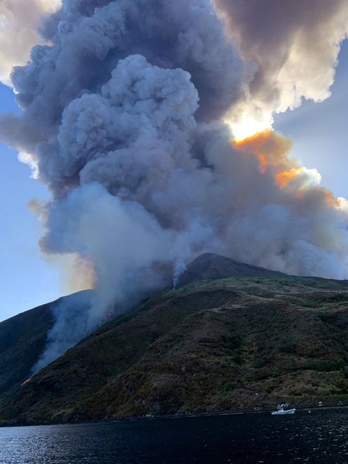 The island of Stromboli was hit by a set of violent volcanic eruptions spurring beach tourists to take into the sea. Two new lava spouts are creeping down the volcano.  