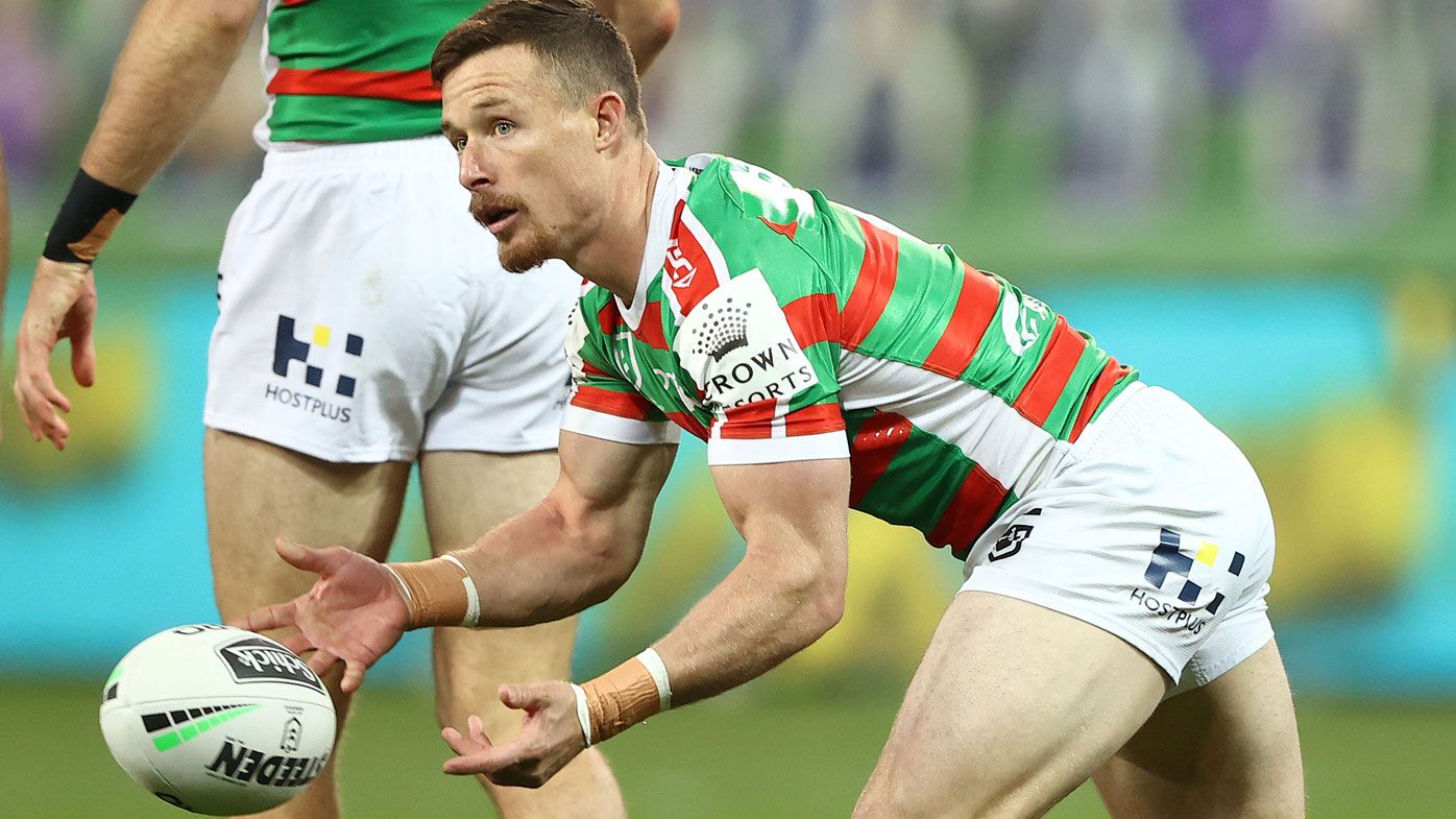 Damien Cook of the Rabbitohs passes the ball 