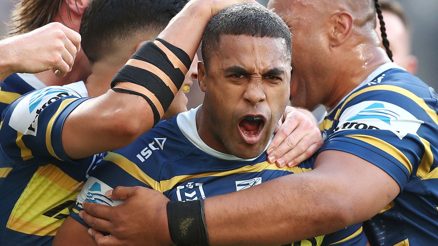 Michael Jennings of the Eels celebrates scoring a try