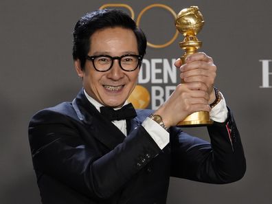 Ke Huy Quan poses in the press room with the award for best performance by an actor in a supporting role in any motion picture for "Everything Everywhere All at Once" at the 80th annual Golden Globe Awards 