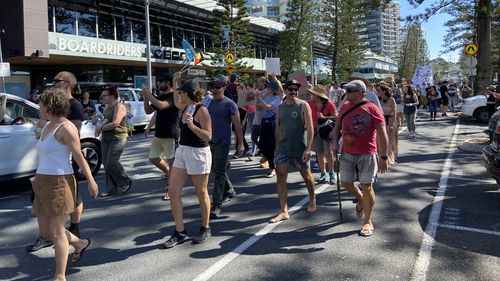 People gathered on Coolangatta Esplanade protesting an end to vaccinations and lockdown. 