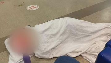 An Adelaide family went public with claims their mother was forced to sleep on the emergency department floor with stomach pain for more than five hours on Saturday night.