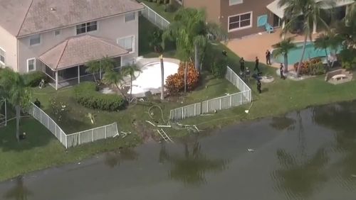 The plane crashed into a pond in a residential neighbourhood of Fort Lauderdale, Florida.