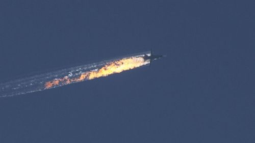 The plane on fire over the Kizildag region of Turkey's Hatay province. (Getty)