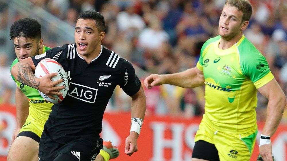  Isaac Te Aute (front) of New Zealand in action against Australia in their  Sevens Plate semi-final.
