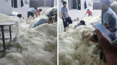 China factory staff stomp on noodles