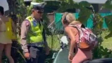 The Australian woman shouted at a policeman after she was stopped for not wearing a helmet.