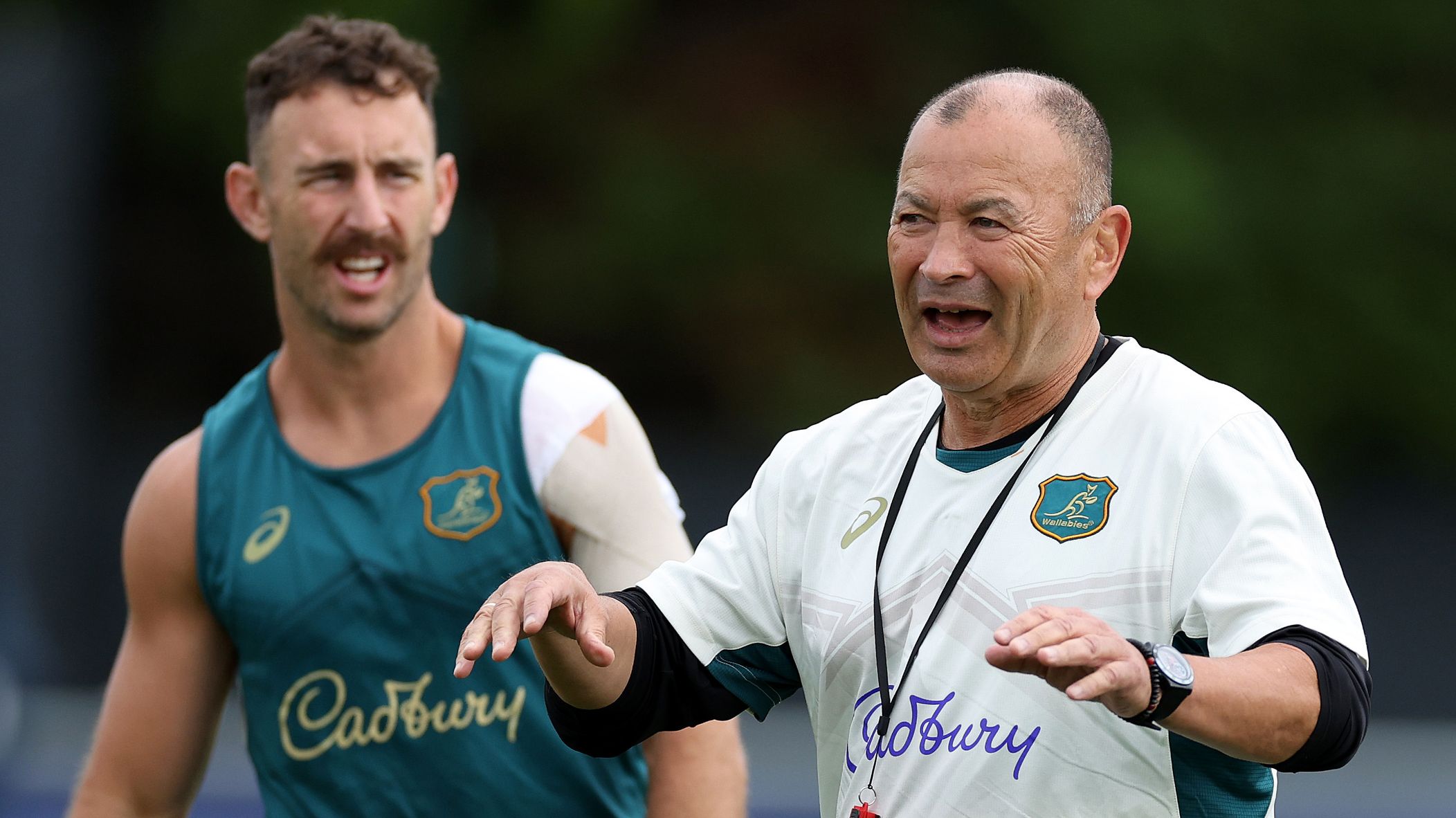 Wallabies coach Eddie Jones (right) with Nic White during a training session.