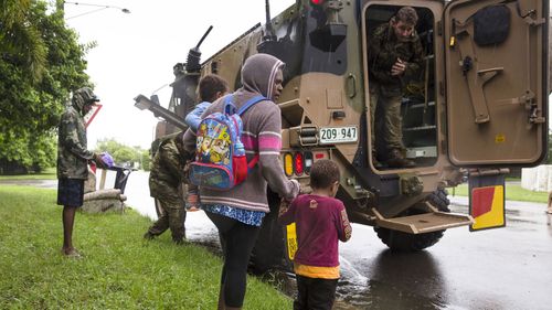 Police and soldiers have been door-knocking on homes, urging families to leave before dark