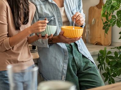 couple splitting costs moving in together