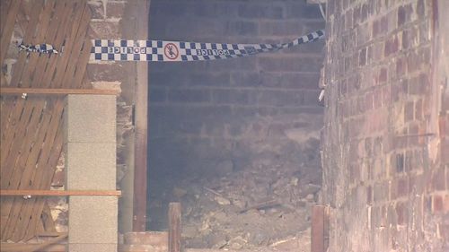 A 23-year-old made the discovery, unearthing a foot and ankle underneath the stairwell while clearing out the garage. Picture: 9NEWS