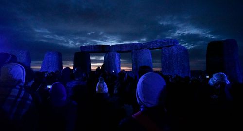 The northern summer solstice attracts hundreds of people to Stonehenge.