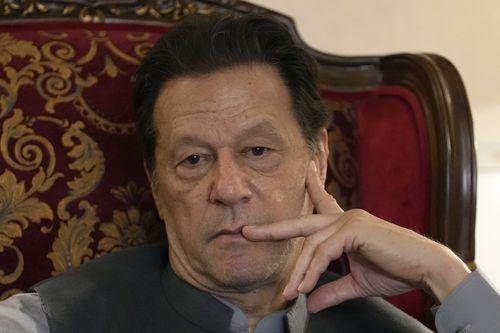 Pakistan's former prime minister Imran Khan listens to a member of media during talk with reporters regarding the current political situation and the ongoing cases against him at his residence, in Lahore, Pakistan, Thursday, Aug. 3, 2023