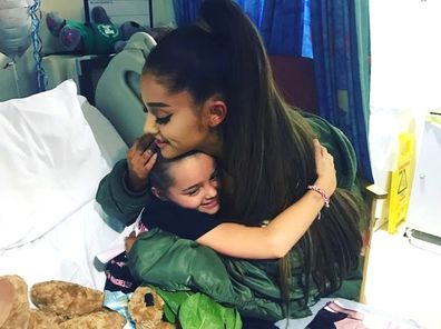 Victim of the Manchester concert blast Lily Harrison hugs singer Ariana Grande during her visit to the Royal Manchester Children's Hospital. Grande surprised young fans injured in the Manchester Arena attack, hugging the thrilled little girls in their hospital beds as they recovered from injuries sustained in the May 22, 2017 suicide bombing. The attack killed 23 people.