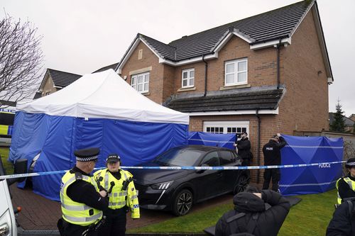 Officers from Police Scotland outside the home of former chief executive of the Scottish National Party (SNP) Peter Murrell, in Uddingston, Scotland, Wednesday, April 5, 2023. 