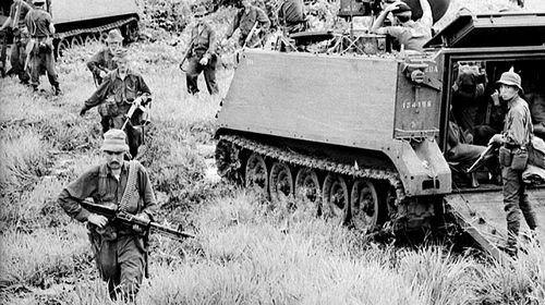 Troops of 1APC Squadron and infantry sweep the area the day after the battle of Long Tan in then Phuoc Tuy province of South Vietnam, now Ba Ria-Vung Tau province of Vietnam. (AAP)