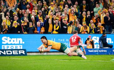 Tom Wright of the Wallabies makes a break to score a try.