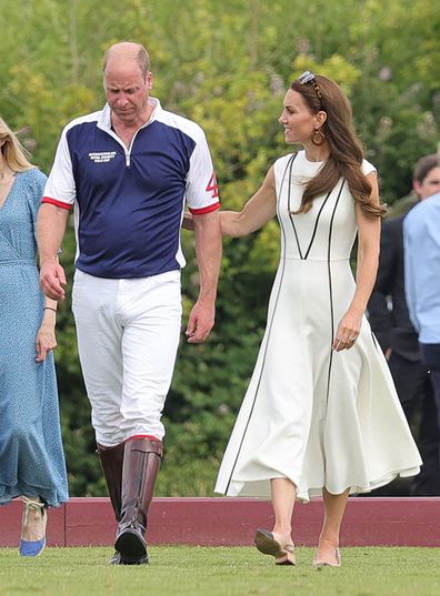 Prince William, Duke of Cambridge and Catherine, Duchess of Cambridge cross the pitch after the Royal Charity Polo Cup 2022 at Guards Polo Club 