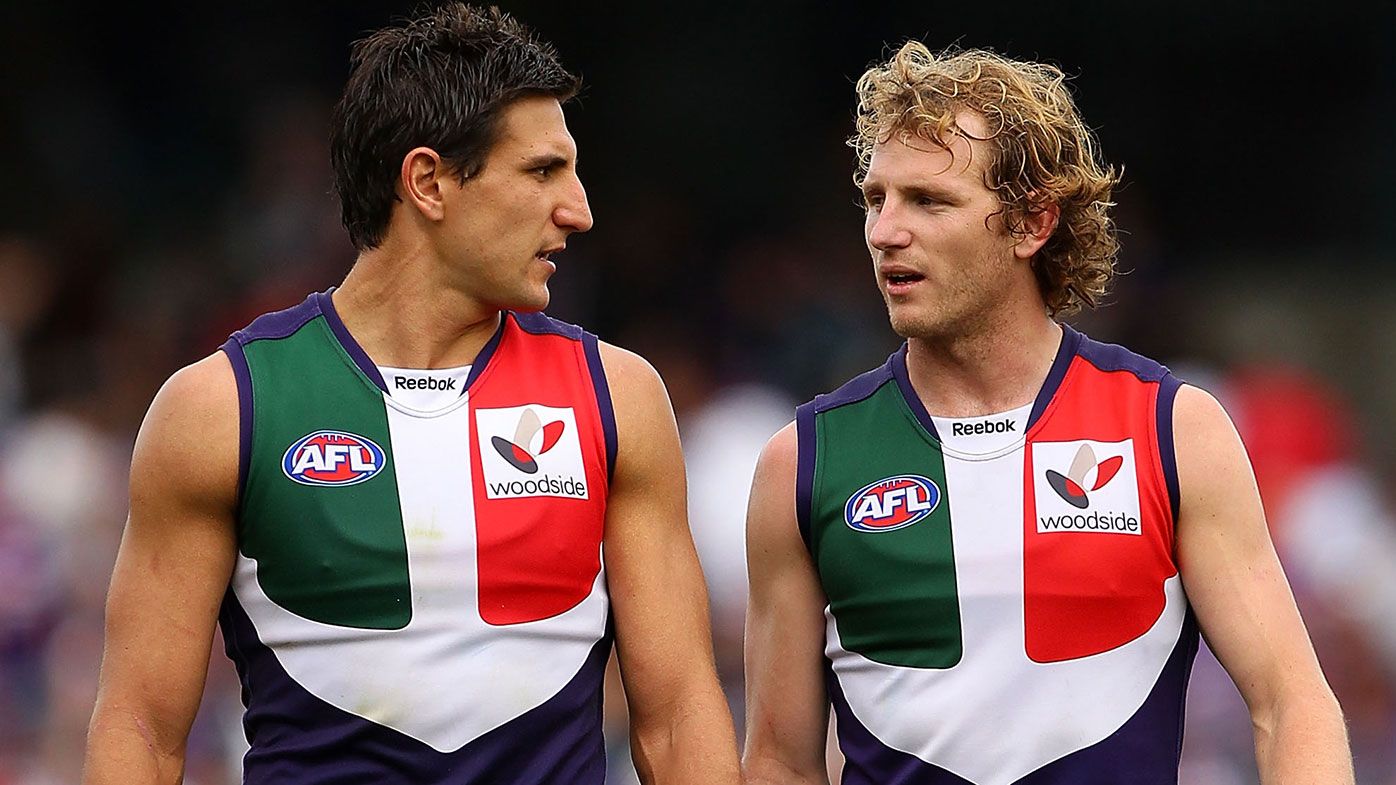 Matthew Pavlich and David Mundy of the Dockers talk as they walk to the three quarter time huddle during the AFL Second Elimination Final match between the Fremantle Dockers and the Hawthorn Hawks at Subiaco Oval on September 4, 2010 in Perth, Australia. (Photo by Paul Kane/Getty Images)