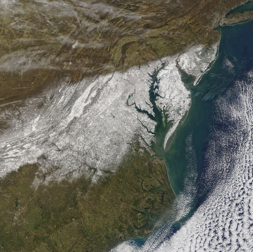 The aftermath of a snow storm has been captured by NASA satellites circling above the US. 