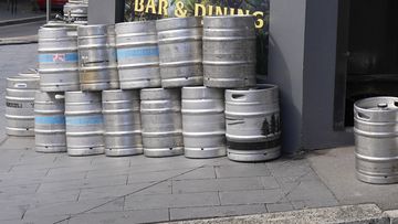 As businesses prepare to reopen in Sydney, there are concerns about what coming into contact with a case would mean for staff. Sydney lockdown ending pub bar kegs on September 21, 2021. (AP Photo/Mark Baker)