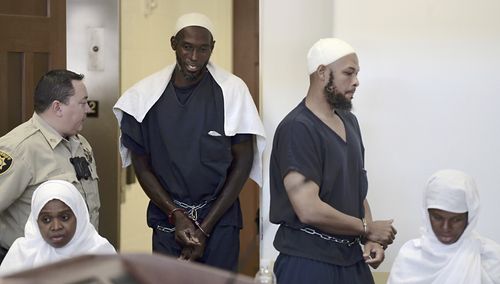 Defendants, from left, Hujrah Wahhaj, Lucas Morton, Siraj Wahhaj and Subbannah Wahhaj enter district court in Taos, N.M.