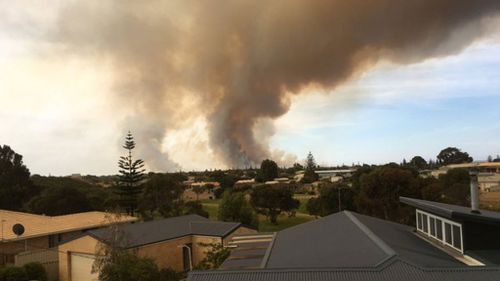 WA bushfire threat remains as locals grieve killed workers