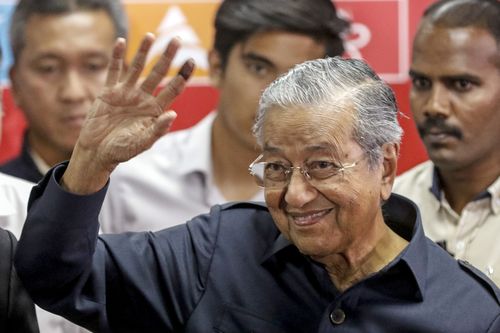 Malaysian Prime Minister Mahathir Mohamad waves at the end of a press conference in Kuala Lumpur, Malaysia, 12 May 2018. Malaysia's newly elected Prime Minister Mahathir Mohamad has named three new senior ministers in his cabinet after he won a historic election victory on 09 May. EPA/AHMAD YUSNI