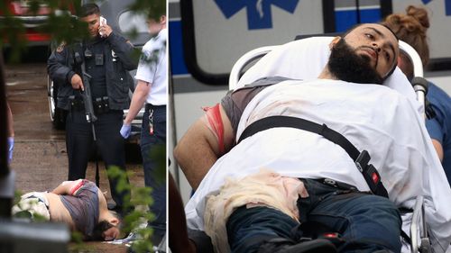 Police stand over Rahami after he was shot and wounded during a tense shootout and arrest.