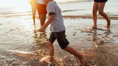 A child playing at the beach