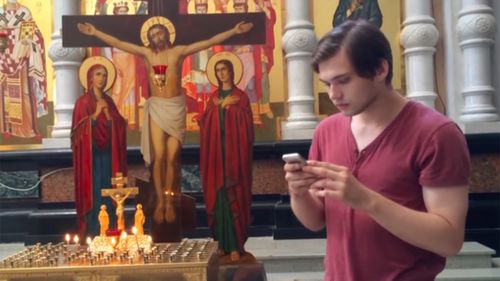 The Russian plays Pokemon Go in an Orthodox church. (YouTube)
