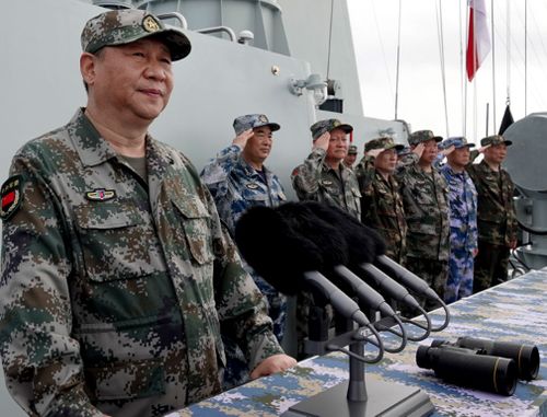 China President Xi Jinping, left, inspects a naval parade earlier this year.