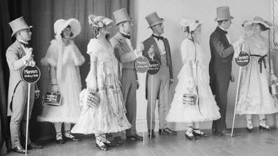 Robertson & Moffatca.  1910s.  1930 group of four men and four women standing, modeling clothes by Robertson & Moffats, house of quality.